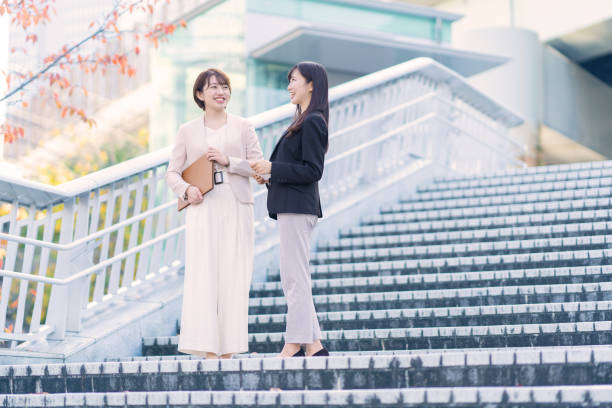 istock Two women smiling in business district 1449828448