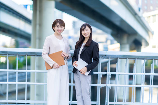 istock Two women smiling in business district 1449828457