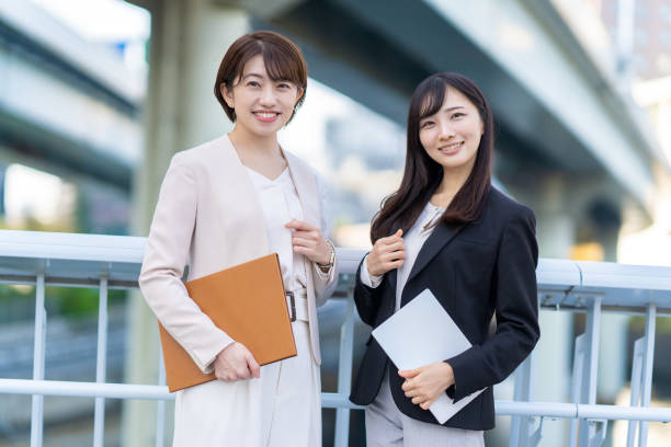 istock Two women smiling in business district 1449828466