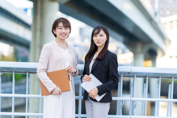 istock Two women smiling in business district 1449828475