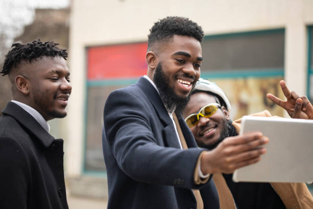 istock Three men talking with a colleague through an iPad 1449829307