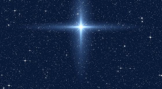 Christmas Star of the Nativity of Bethlehem, Nativity of Jesus Christ. Background of the beautiful Bright star on starry sky