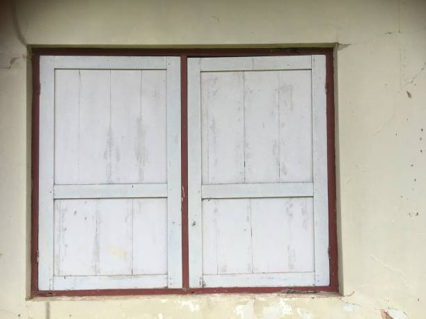 istock Old, retro, and vintage house window on the wall 1449835102