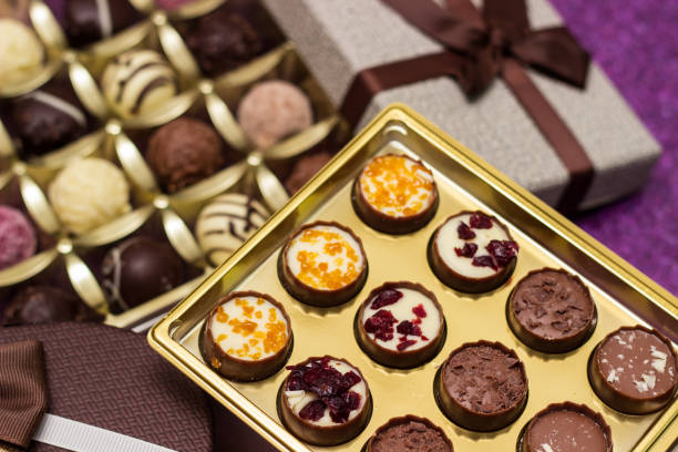 istock Box with delicious chocolate candies and heart shape gift 1449836296