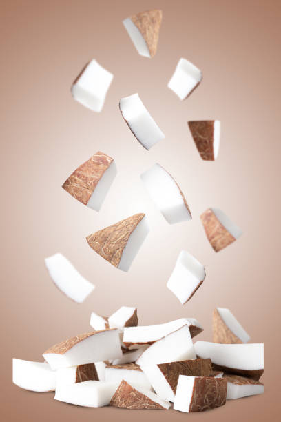 Flying of chopped coconuts pieces.