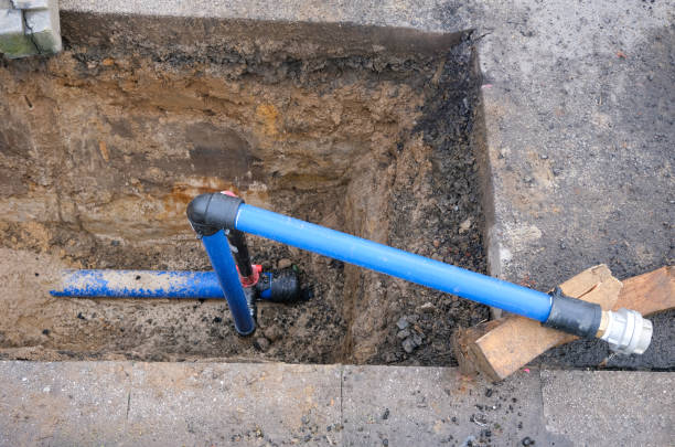 istock View from above into an open excavation pit with a new water connection with a shut-off valve, pipes and other supply lines 1449838048