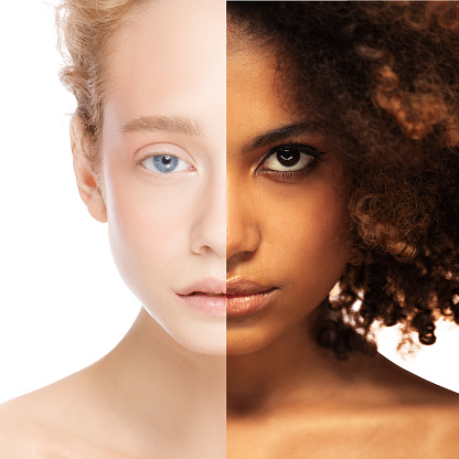 Diversity concept. Collage of two half face women, african and caucasian females, isolated on white background