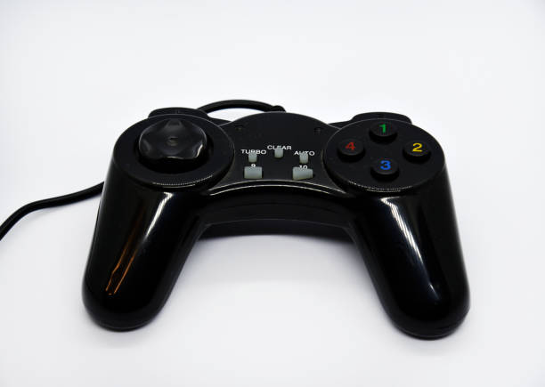 istock The gamepad is black and shiny on a white background. Game joystick close-up. A gamepad for a game console. 1449843272