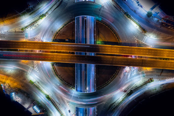istock Expressway top view, Road traffic an important infrastructure, Drone aerial view fly in circle, traffic transportation, Public transport or commuter city life concept of economic and energ, transport. 1449843465