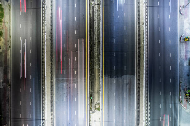 istock Expressway top view, Road traffic an important infrastructure, Drone aerial view fly in circle, traffic transportation, Public transport or commuter city life concept of economic and energ, transport. 1449843485