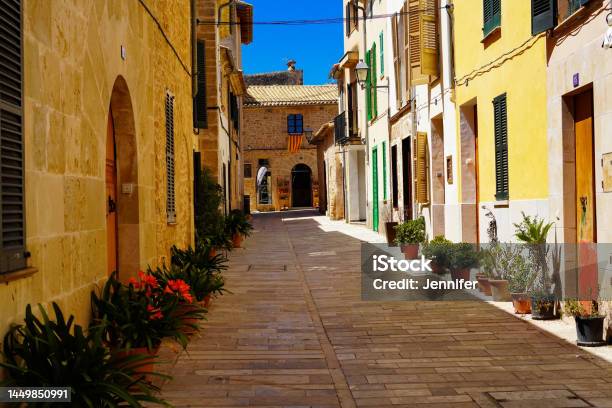 Narrow Street In The Old Town Of Alcúdia Mallorca In Spain Stock Photo - Download Image Now