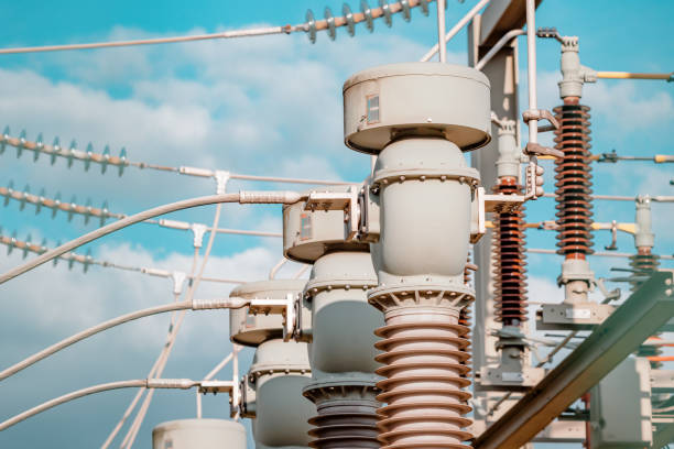istock Current and voltage converter for an electrical substation. Dielectric insulator close-up. Transformation and transmission of electricity from generator to consumers 1449856922