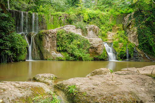 Can Batlle natural pool with its waterfalls in the town of Santa Pau in Girona, Catalonia.