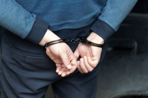 istock The perpetrator is a man in handcuffs. 1449860318
