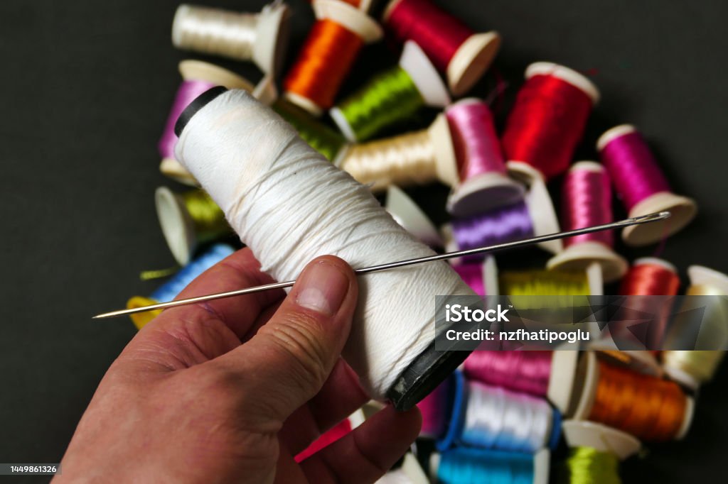 Closeup There Are Lots Of Colorful Spools Of Thread Thick Sewing Thread Big  Needle Stock Photo - Download Image Now - iStock
