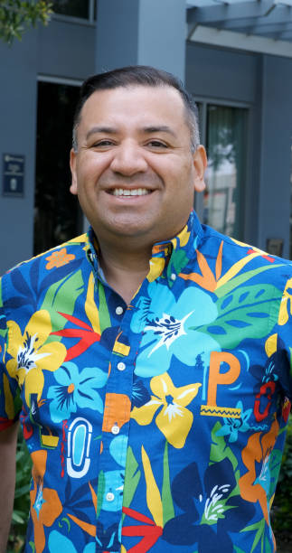 istock Smiling hispanic mature man looking at the camera smiling 1449861636