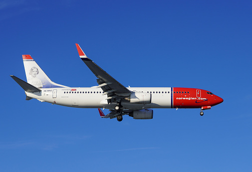 London Gatwick, United Kingdom - December 16, 2022, Norwegian Airlines Boeing 737 on final approach to landing at London Gatwick airport.  Norwegian airlines is a low-cost airline and Norway's largest airline. It is the fourth largest low-cost carrier in Europe behind Wizz Air, easyJet and Ryanair.