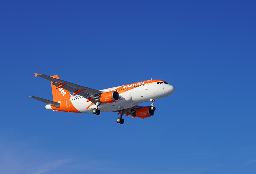 London Gatwick, United Kingdom - December 16th 2022: Airbus A-319 airplane of the company Easyjet on final approach before landing at London Gatwick airport. EasyJet is a British low-cost airline based at London Luton Airport. It operates domestic and international scheduled services on over 1,000 routes in more than 30 countries.