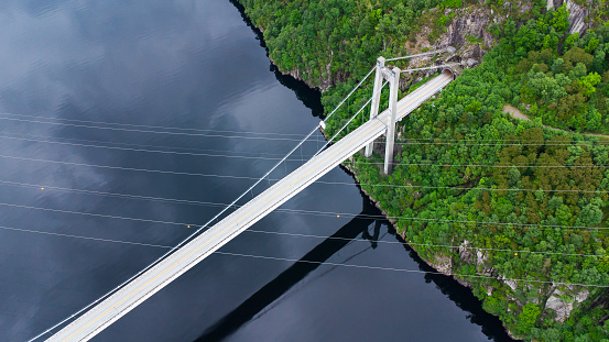 Aerial view of the Fedafjorden bru bridge with crossing power lines and a tunnel portal