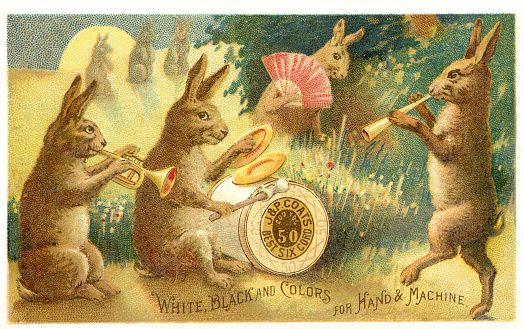 Chromolithograph of rabbit band in meadow at night. J & P Coats spool of thread being used as a drum. Victorian advertising trade card for J & P Coats Best Six Cord sewing thread. Donaldson Brothers, NY, lithographer (1872-1891) 1887.