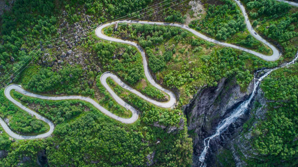 Aerial drone view of the windy road Lysevegen down to the Lysefjorden in Norway on a beautiful summer day Aerial drone view of the windy road Lysevegen down to the Lysefjorden in Norway on a beautiful summer day lysefjorden stock pictures, royalty-free photos & images