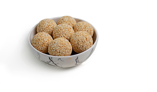 Indian sweet for traditional festival makar sankranti Rajgira laddu made from Amaranth seed in Bowl on white background