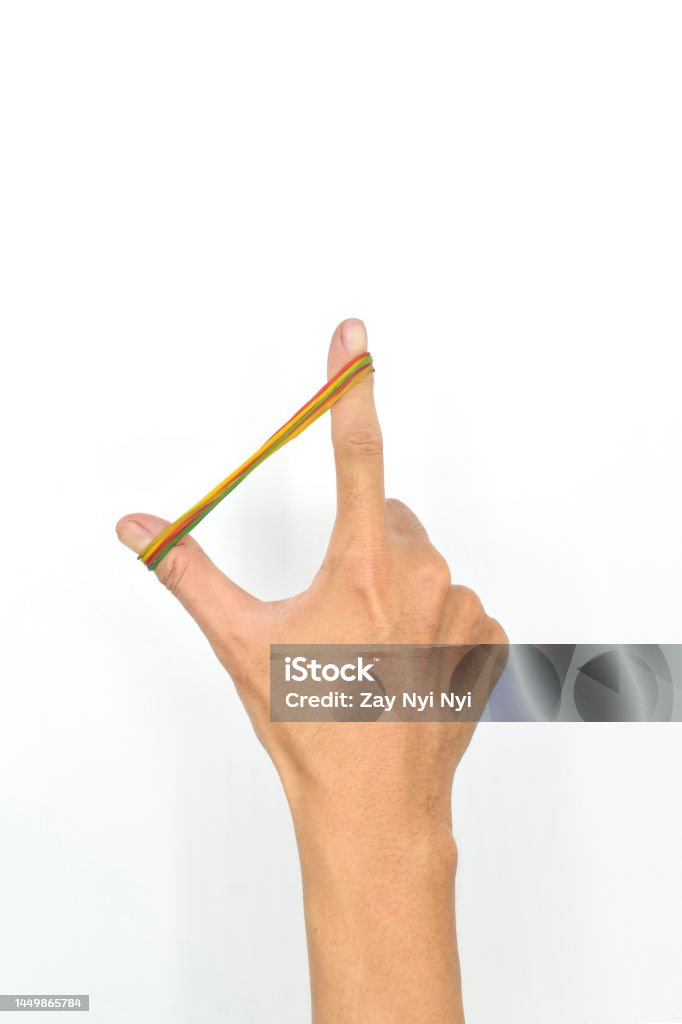 Leather ring exercise for hand muscle strength. Fingers rehabilitation. Leather ring exercise for hand muscle strength. Fingers rehabilitation. Isolated on white. Rubber Band Stock Photo