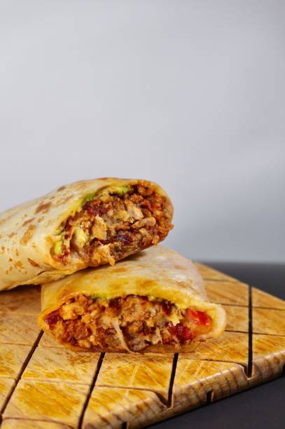 istock Pastor mexican burrito with meat and hot sauce 1449865989