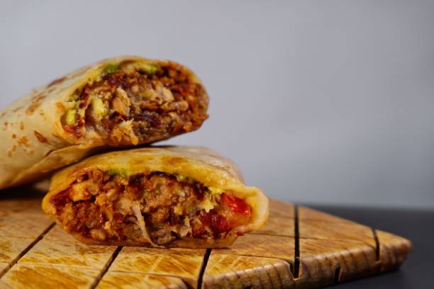 istock Pastor mexican burrito with meat and hot sauce 1449865991