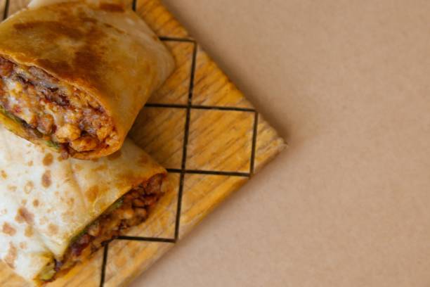 istock Pastor mexican burrito with meat and hot sauce 1449866054