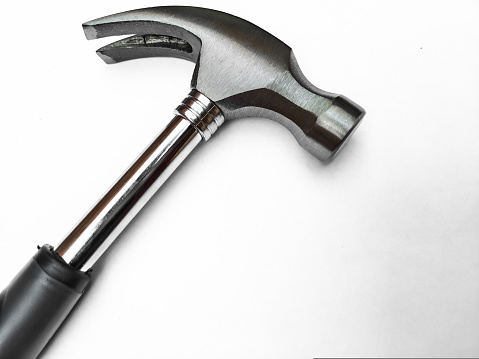 A Hammer isolated on white background. Hammer and nail puller, two in one. Close up of a Hammer with a rubberized handle.