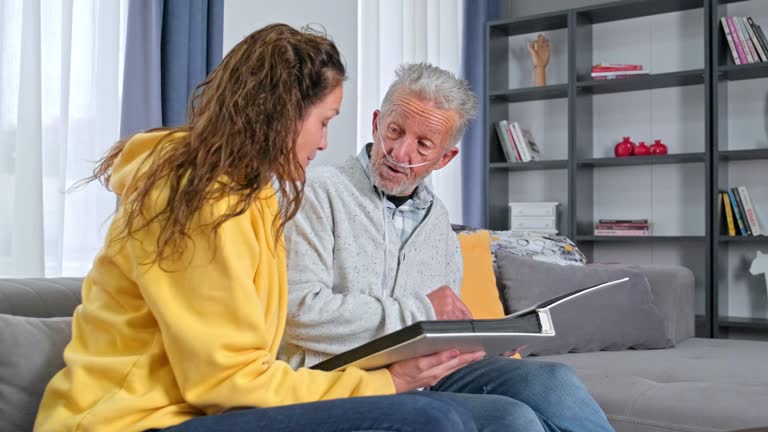 Grandad showing his daughter memories from past