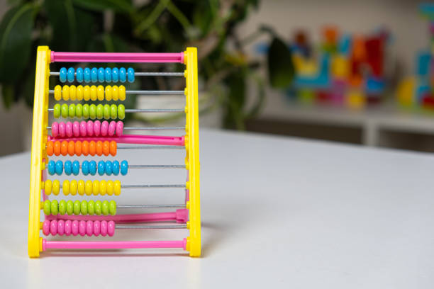 istock Colorful children's abacus on the table. Mathematics, arithmetic for preschool and school children, learning to count 1449871706