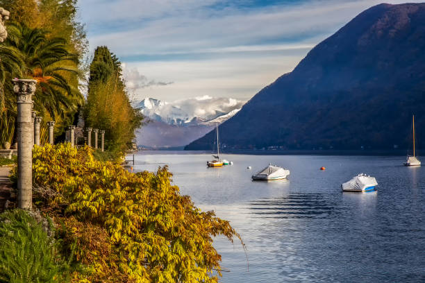 Sheltered sailboats  in lake lugano -  view from park Helenium with columns