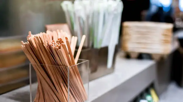 Wooden mixing sticks in coffe shop close up