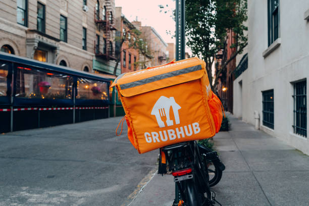 Grubhub bag on a delivery bike on a street in Manhattan, New York, USA. stock photo