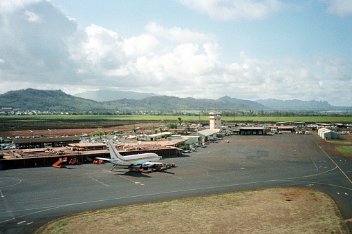 A vintage 1980s film photograph of the runway of Maui airport.