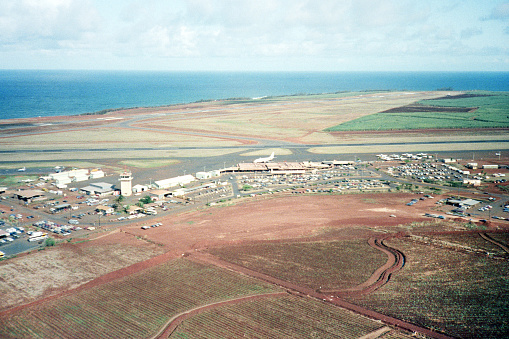 A vintage 1980s film photograph aerial view of the small airport on Maui.