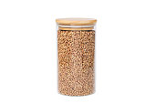 Glass jar with buckwheat on a white isolated background.
