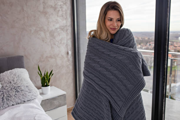 istock Woman Wrapped Up in a Blanket 1449887188