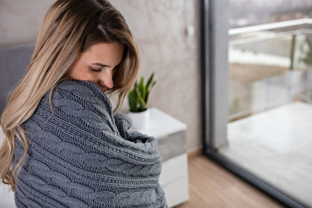 istock Woman Wrapped Up in a Blanket 1449887190