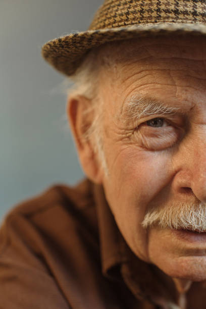 istock Close up. Thoughtful portrait of a gray-haired old man. 1449891621