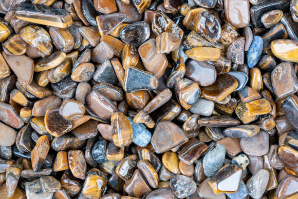 Closeup of various colorful stones quartz, marbles, ore minerals, gems use as ornament and decoration jewelry that contain spiritual force human believes