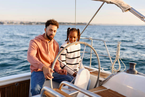 istock Father and daughter sailing a yacht 1449896827