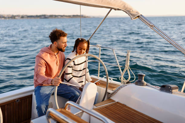 istock Father and daughter sailing a yacht 1449896937