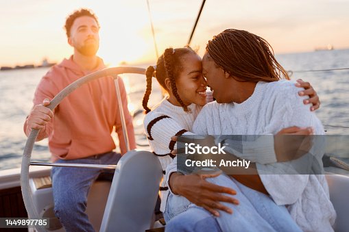 istock Family Yacht Sailing in the sunset 1449897785
