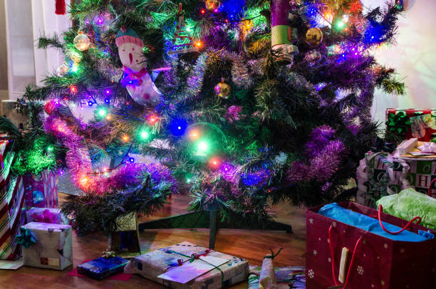 istock Christmas tree with gifts 1449900642