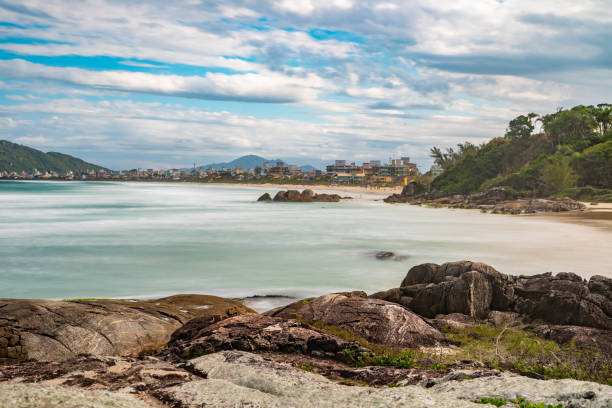 istock Trees, rocks and waves in Atalaia beach 1449903763