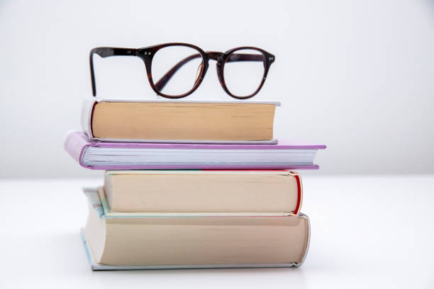 istock Stack of books with glasses on top of them 1449904939