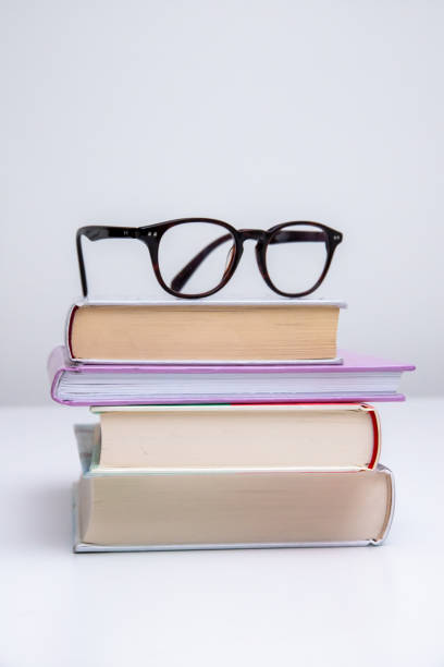 istock Stack of books with glasses on top of them 1449904942
